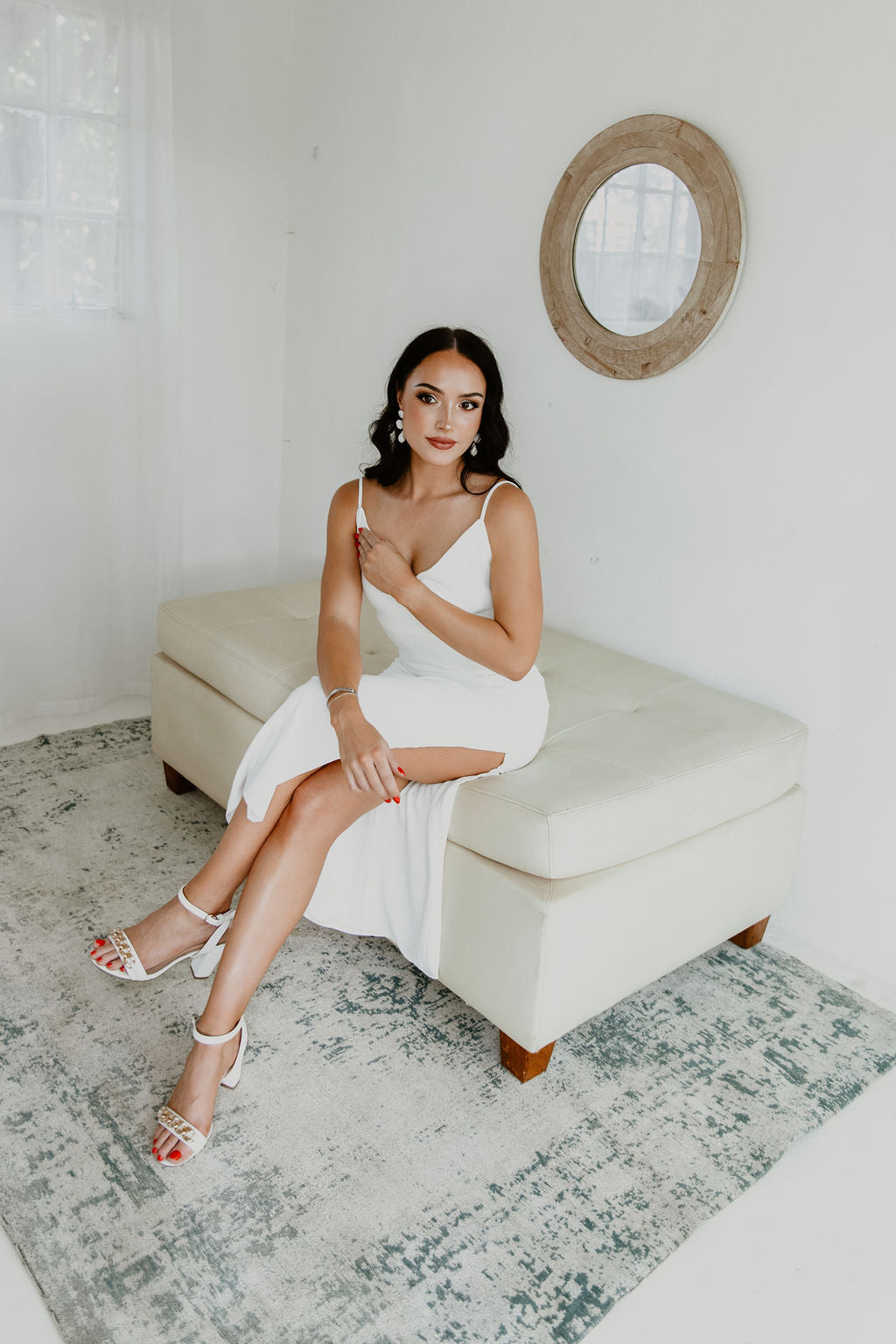 Emily Dress in off-white, calf-length with side slit, styled for a romantic bridesmaid look